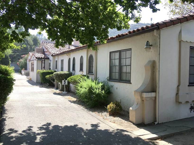Spanish-style home under the trees